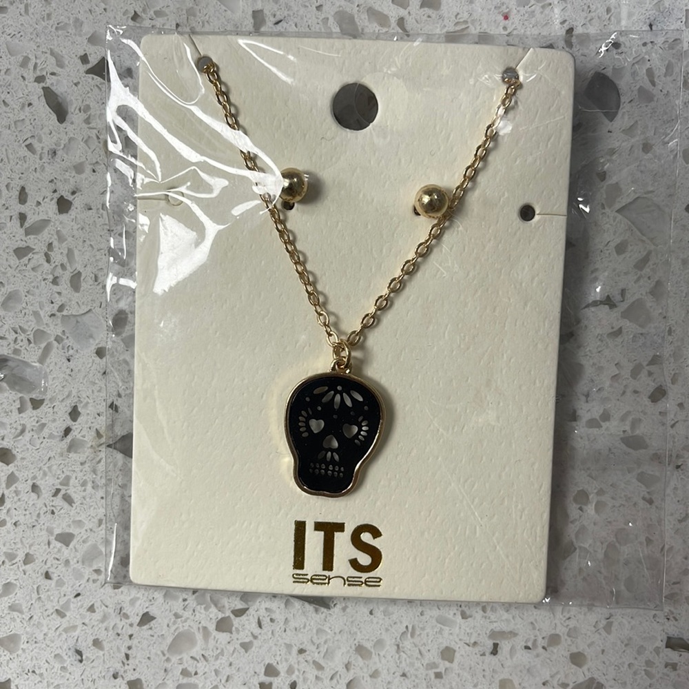 Sugar skull necklace and gold stud earrings